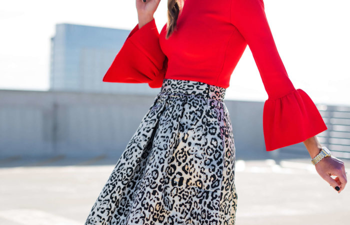 holiday party skirt, holiday outfit inspiration, leopard party skirt, red blouse with bell sleeves, style your senses